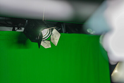 fresnel projector behind a green screen
